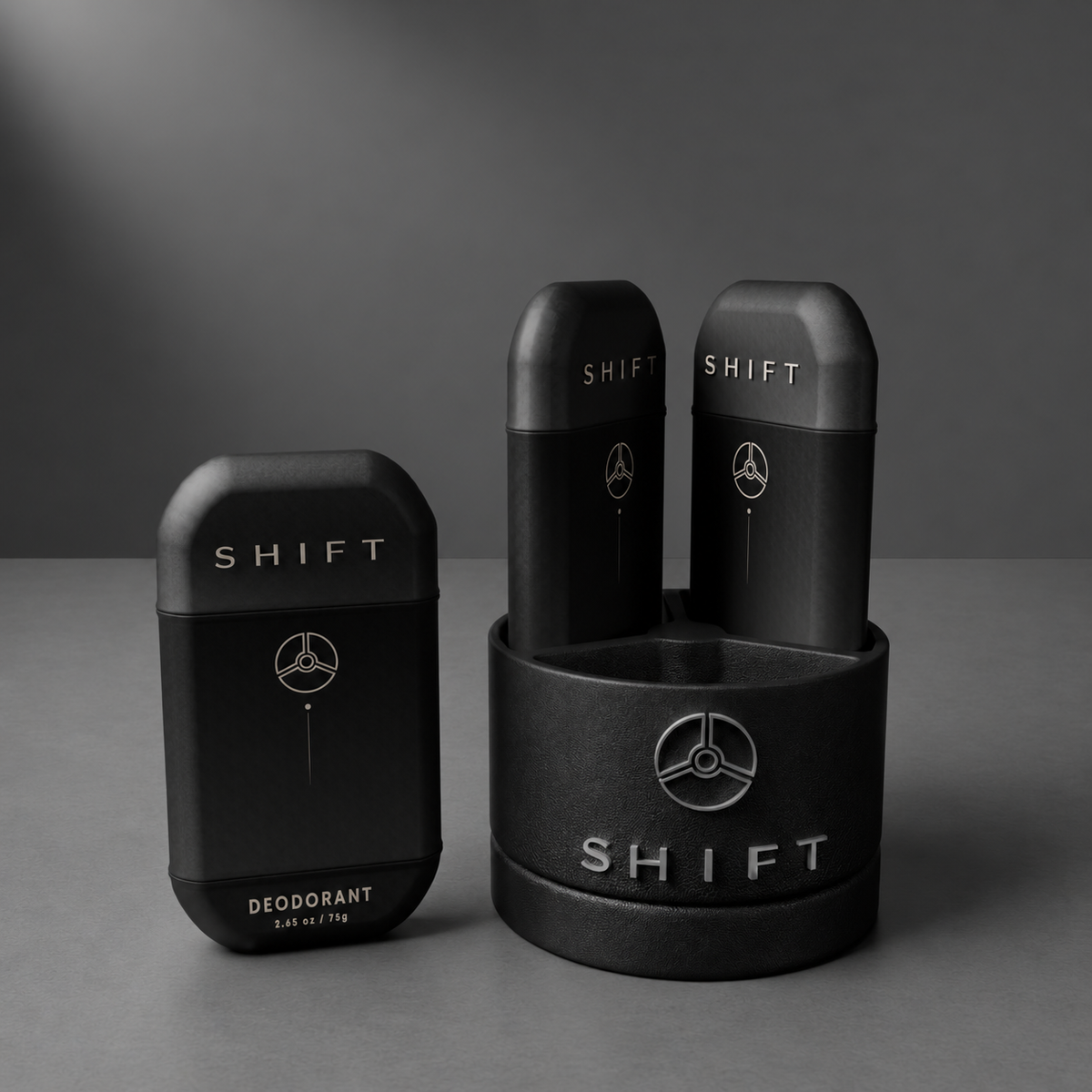 SHIFT deodorant beside a branded base holding two deodorant containers on a gray surface.